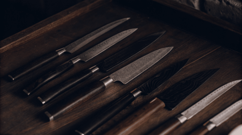 Different Japanese Knives - Japanes Knives Tips The image showcases a variety of Japanese knives, including a sleek gyuto knife with a pointed tip and a sharp blade designed for precision chopping and slicing of vegetables, meat, and fish. This collection highlights the versatility and balance of these chef's knives, emphasizing their importance in any kitchen.