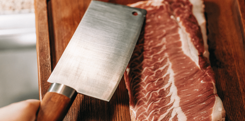 The image depicts a Japanese cleaver, characterized by its rectangular blade shape and super sharp edge, ideal for slicing vegetables and boneless meats. This kitchen knife, often made with stainless steel or carbon steel blades, showcases a sleek design that allows for clean cuts, making it a favorite among professional chefs and home cooks alike.