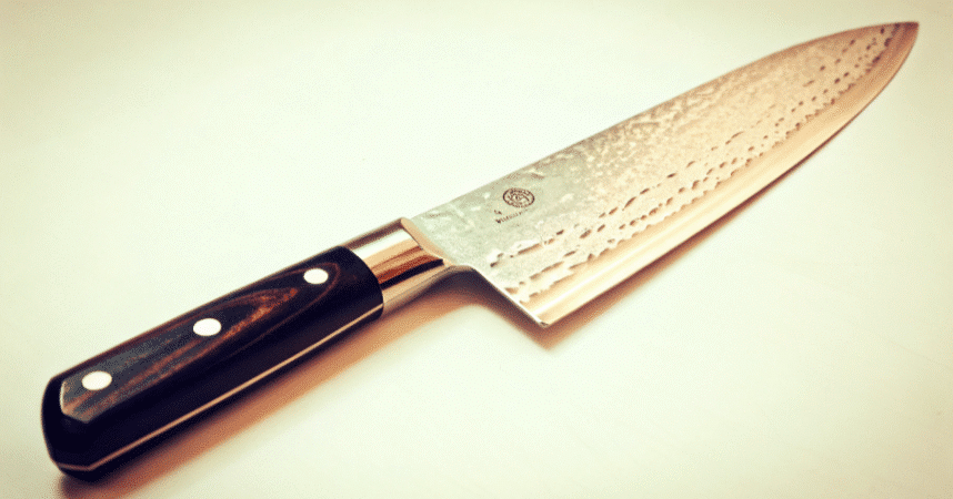 A single Gyuto knive on a white background.